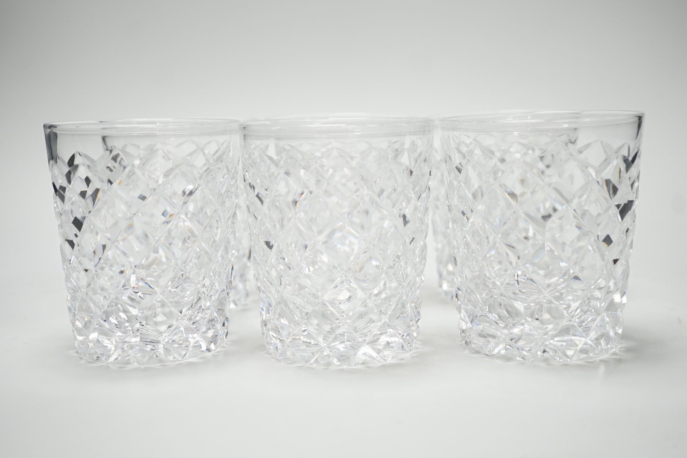 A set of six heavy hobnail cut glass whisky tumblers. 10cm high